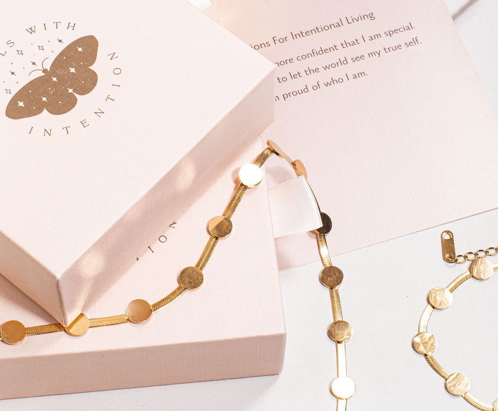 Two coordinating Jewels With Intention pieces styled on a model